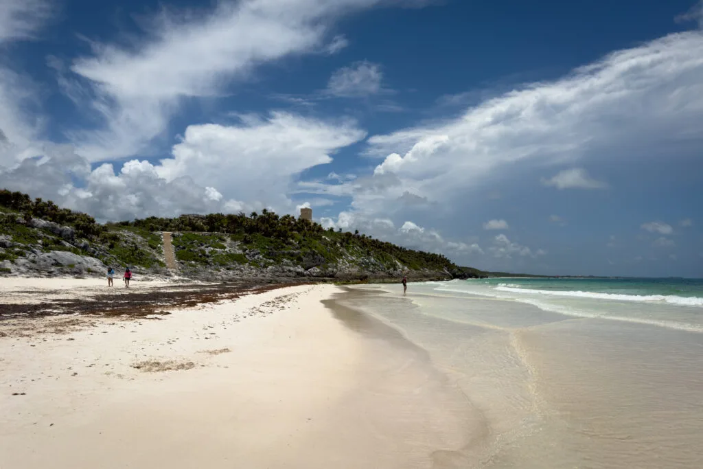 Playa Santa Fe with white sand and crystal-clear waters in Parque Jaguar, a unique experience to have in Tulum.
