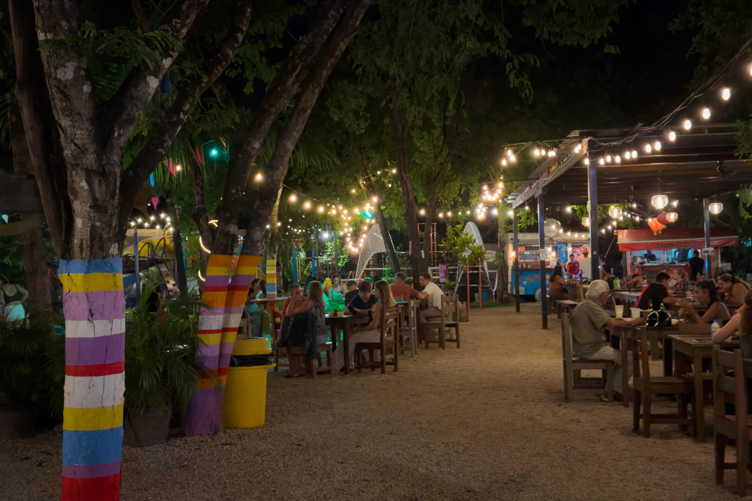 Playa Central, a unique spot with food stalls and live music, perfect for a different night out in Tulum.